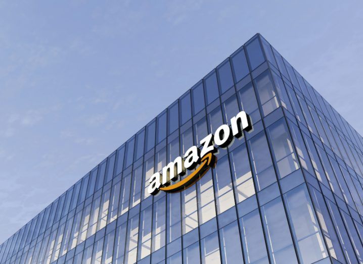 A large glass-fronted office building bearing the Amazon logo.