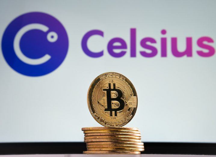Pile of coins with the bitcoin logo, in front of a white screen with the Celsius logo on it.