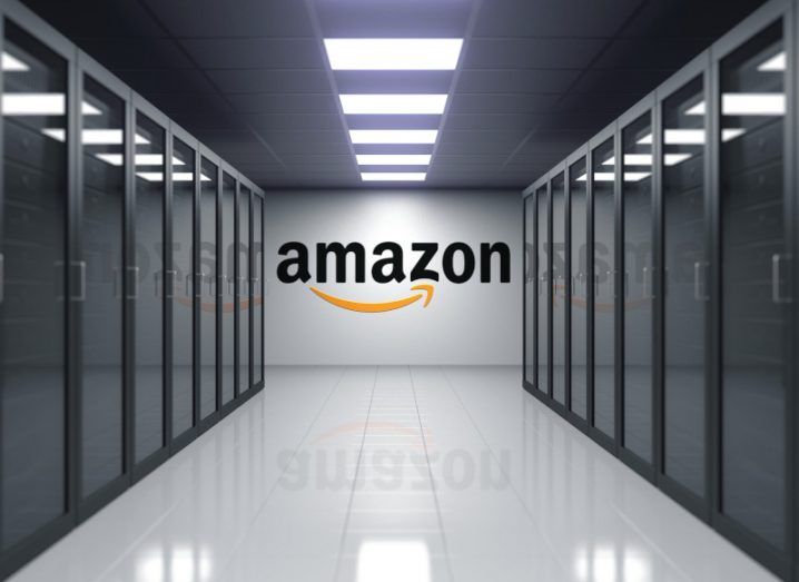 Interior of a data centre with the Amazon logo on a wall in the background.