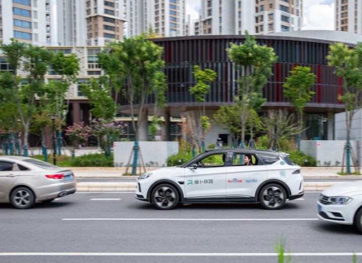 A Baidu driverless taxi on a city street.