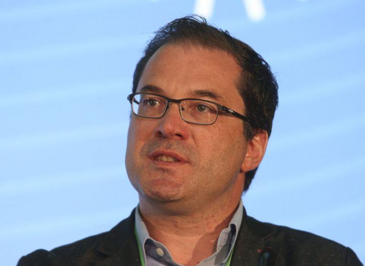 A headshot of Alan Costello of Resolve Partners speaking at an event.