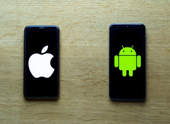 An iPhone with the Apple logo placed next to a smartphone with the Android logo.