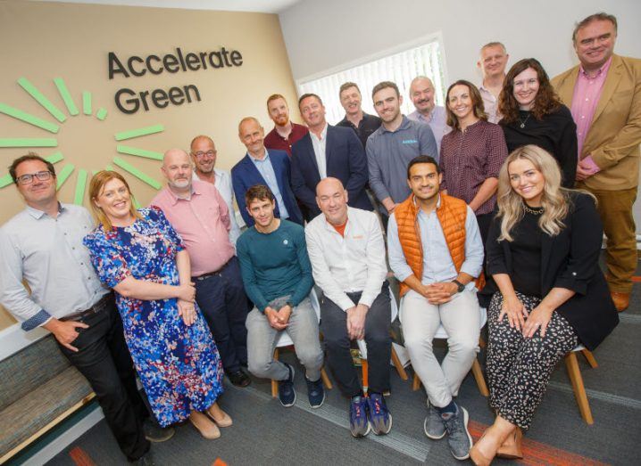 Founders of climate start-ups in Ireland taking part in the Accelerate Green pre-accelerator pose for a group photo. The text 'Accelerate Green' is visible on the wall in the background.