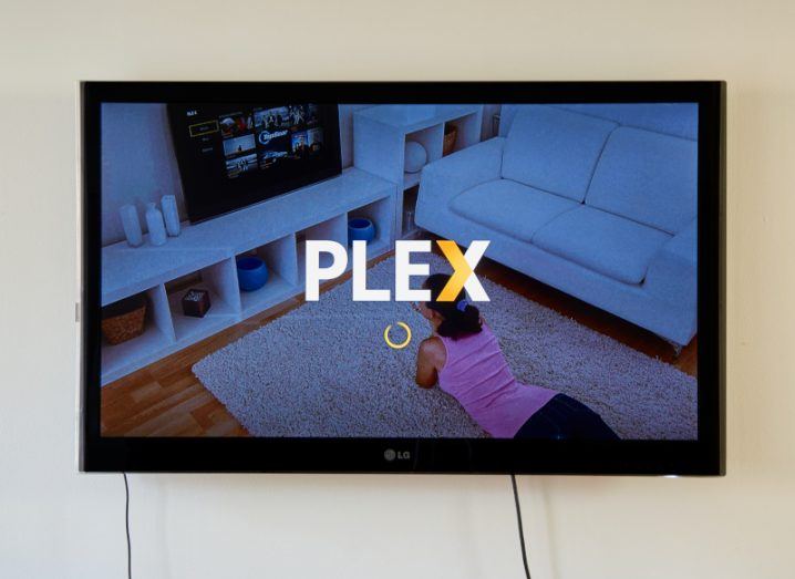 Plex service on a TV screen mounted on a wall.