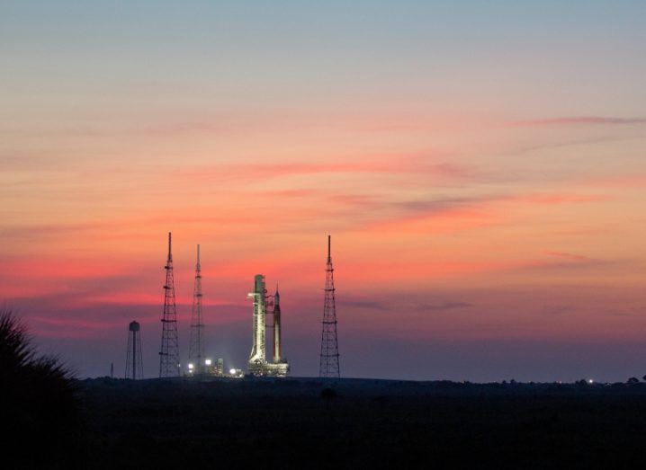 The spacecraft for the Artemis 1 mission stands on the launchpad at sunrise.