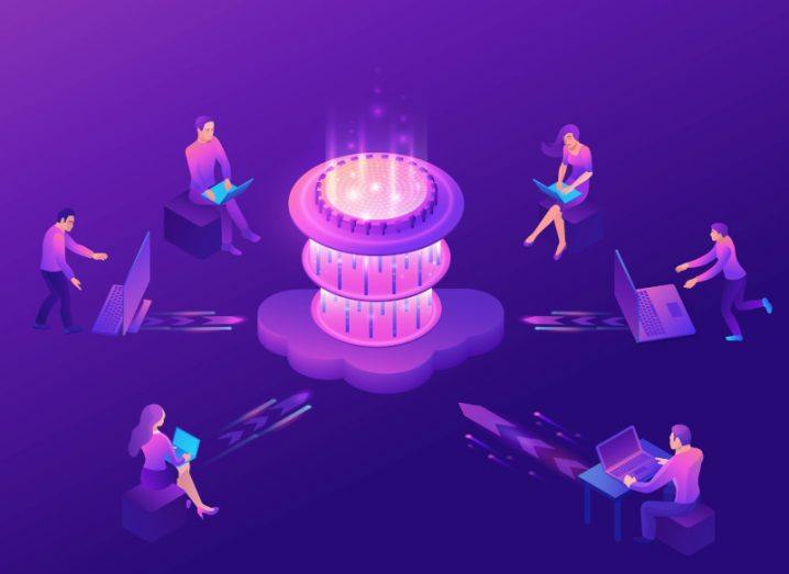 Illustration of a quantum computer surrounded by six people on laptops and phones, in a purple background. Used to represent a post-quantum world.