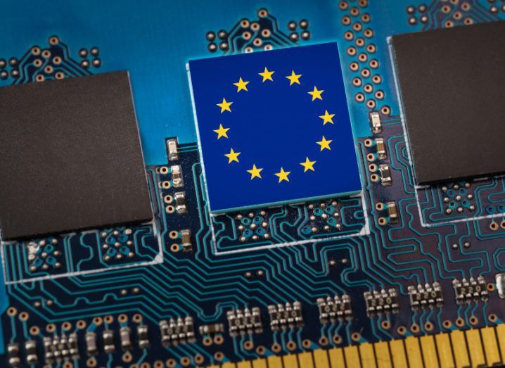The EU flag on a circuit board in an AI tech concept.