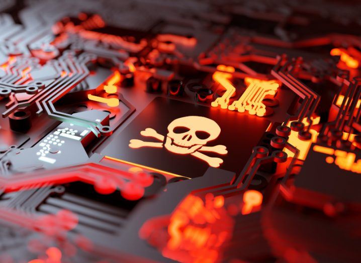 Illustration of a computer motherboard where one component bears a skull and crossbones image, signifying it has been infected with ransomware.