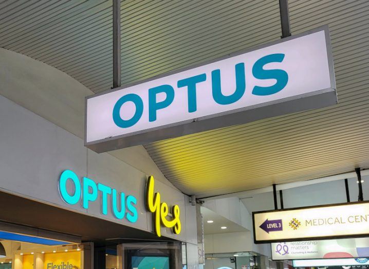 A large light box sign that says Optus outside a store front that has Optus Yes written above the door.