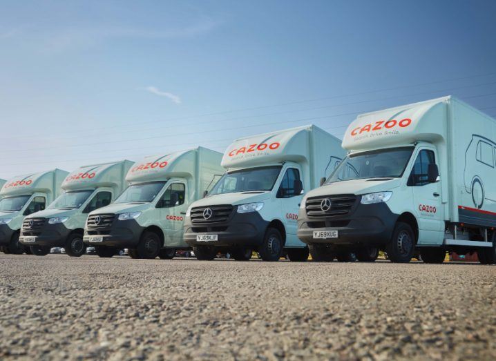 Vehicles with Cazoo logo on them lined up.