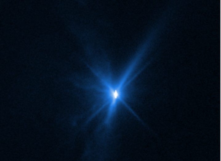A blue light in space, taken by the Hubble Space Telescope. The image shows the aftermath of NASA's DART spacecraft colliding with an asteroid.