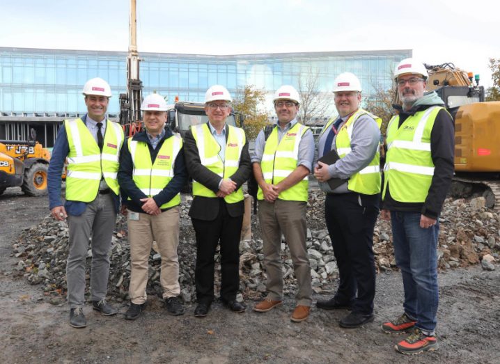 Six men wearing hardhats and high visibility vests at the University of Galway. They are part of the Geofit geothermal project.