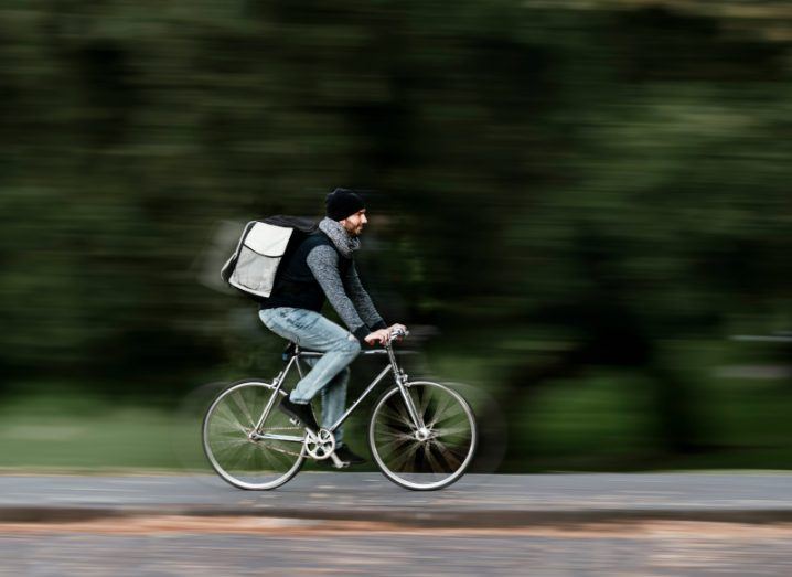 Deliveroo delivery agent riding a bike.