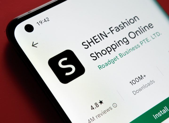 Close-up of smartphone screen with the Shein app shown in an app store.