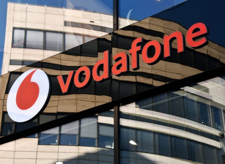 The Vodafone logo on the side of a building.