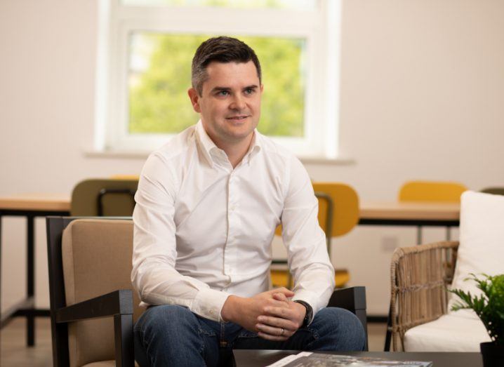 Colm O’Sullivan from Furthr VC sits on a chair in a bright workspace.