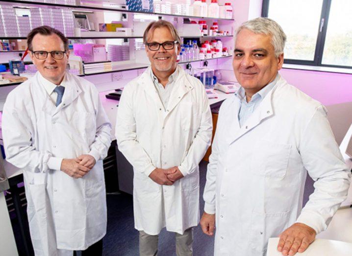Three men standing in a lab wearing lab coats marking the funding boost for CV6 Therapeutics.