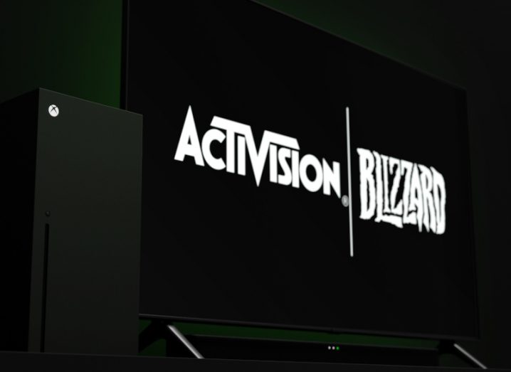 Activision Blizzard logo on a screen next to an Xbox.