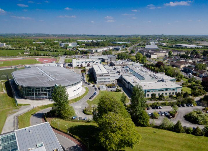 An aerial view of a large college campus on a bright sunny day.