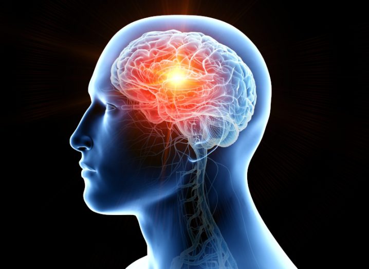 Illustration of a human head with brain cancer. A tumour can be seen glowing inside the brain.