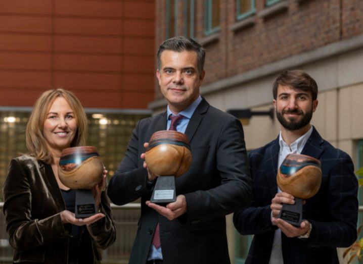 Robert Gerwarth of UCD stands with the two other winners of IRC research awards with trophies in hand.