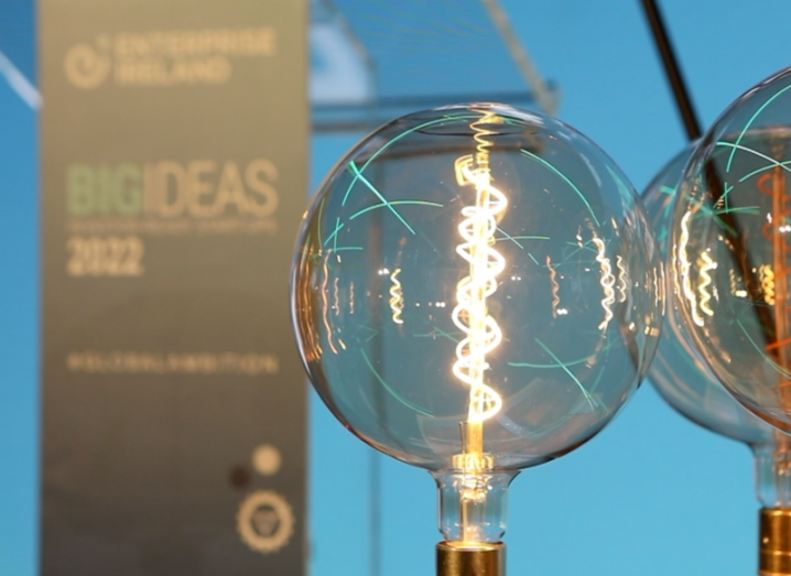 A close-up of a large round lightbulb in front of a sign that says Big Ideas 2022.