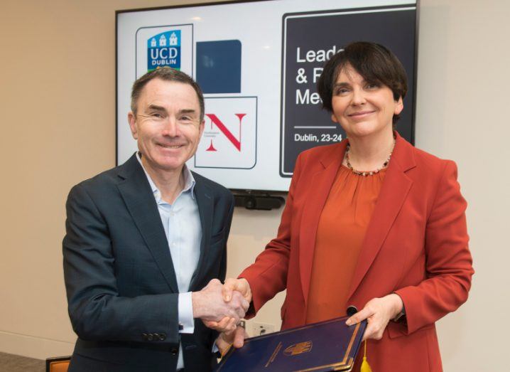 Prof David Madigan of Northeastern University and Prof Orla Feeley of UCD, shaking hands while Feely holds a document.