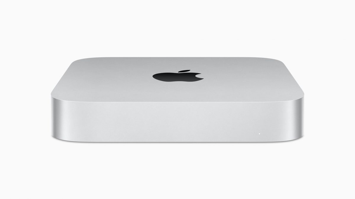 A Mac mini with the Apple logo on the top, in a white background.