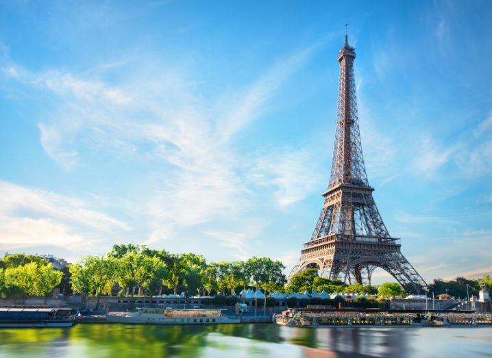 Image of the Eiffel Tower in Paris in the backdrop of the Seine river.