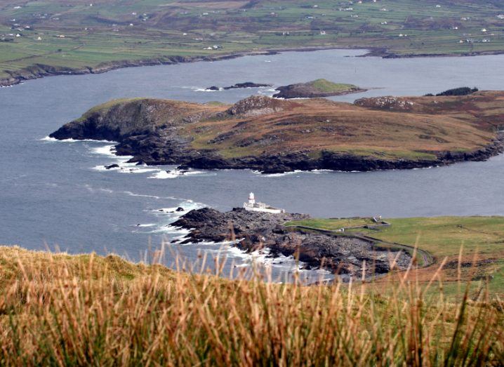 An image of Valentia Island in Kerry, with a lighthouse visible in the distance.