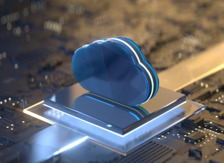 Blue 3D cloud image on a computer chip to conceptualise cloud computing.