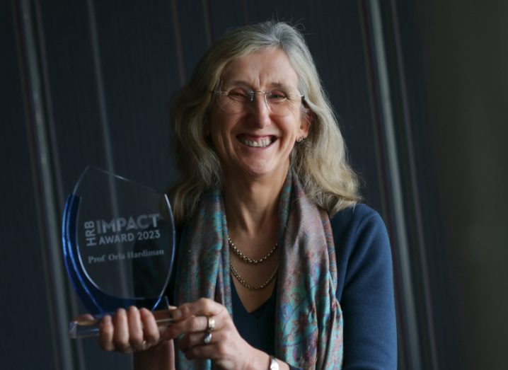 Professor Orla Hardiman holding an award from the Health Research Board in her hands.