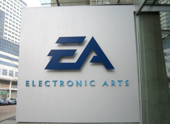 The Electronic Arts EA logo on a white surface next to a building.