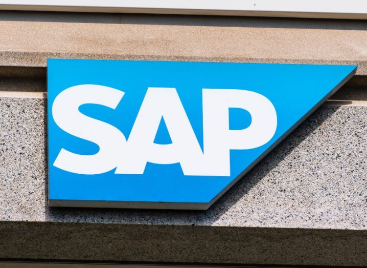 The SAP logo on the front of a grey building wall.