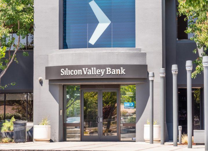 The Silicon Valley Bank logo on the front of a grey building.