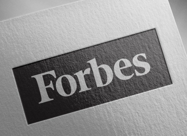 The Forbes logo on a white sheet of paper.