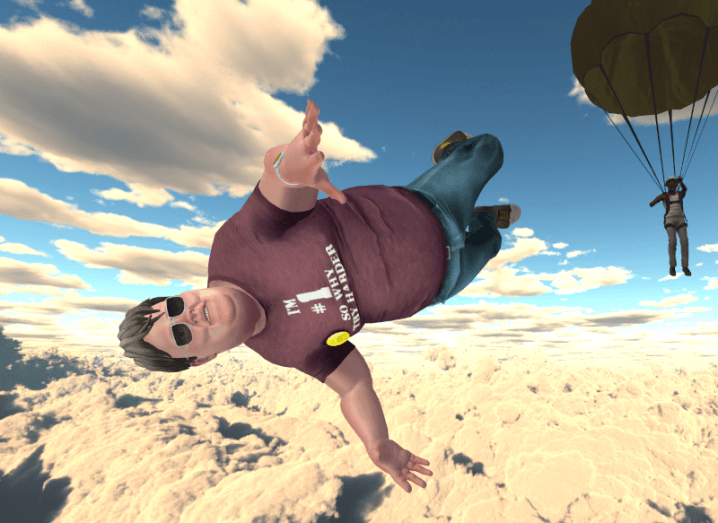 A virtual avatar of Fatboy Slim in the Engage XR metaverse, flying above clouds with a person on a parachute in the background.