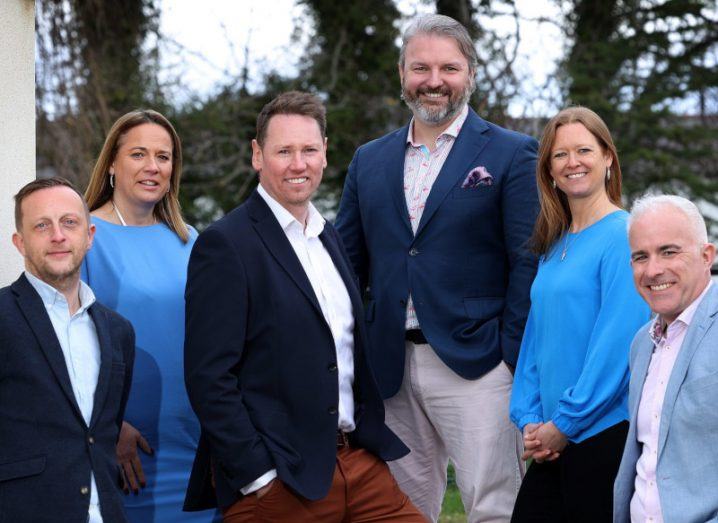 Members of the executive team for Irish start-up ID-Pal all stand around smiling at the camera.