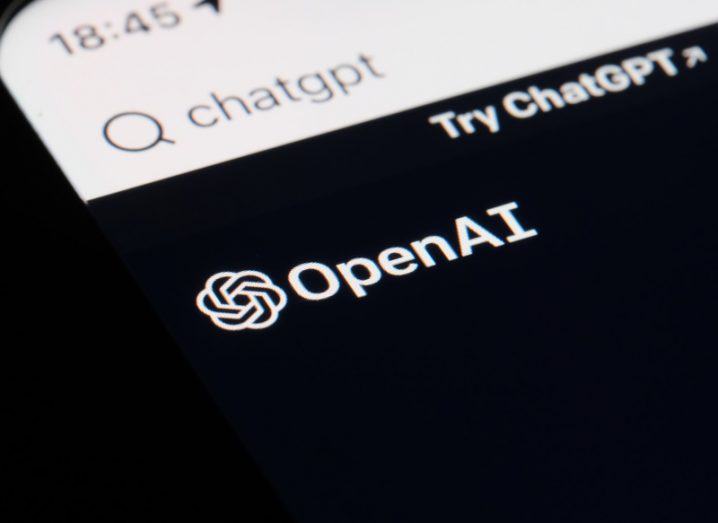 The OpenAI logo on a smartphone screen, with the words "Try ChatGPT" next to the logo.