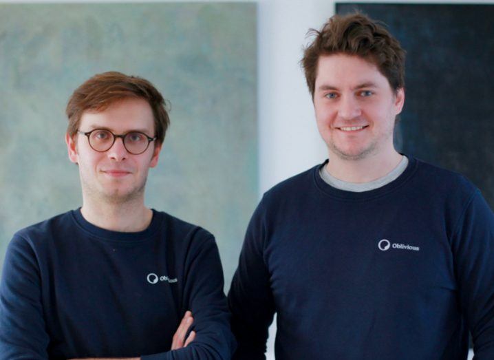 Headshot of the two founders of Oblivious wearing blue tshirts with the start-up logo on each.