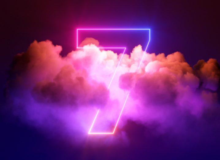 A neon outline of the number seven emerging from a pink smoky cloud.