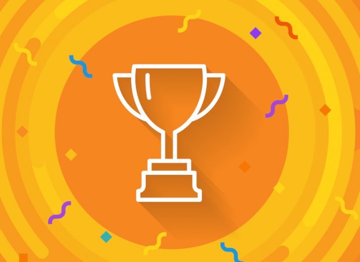 A design of a trophy on an orange background in a prize winning concept.