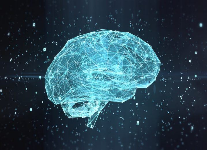 Illustration of a digital brain made of blue light, with zeros around it in a dark background. Used as a concept for AI, artificial intelligence.
