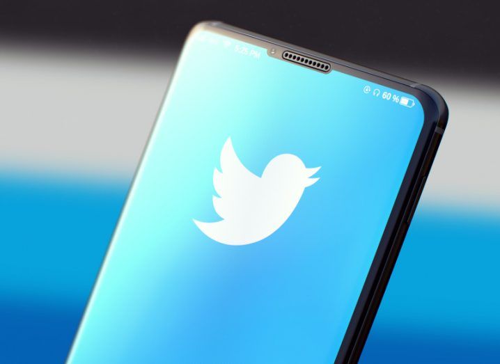 The Twitter logo on a smartphone screen.