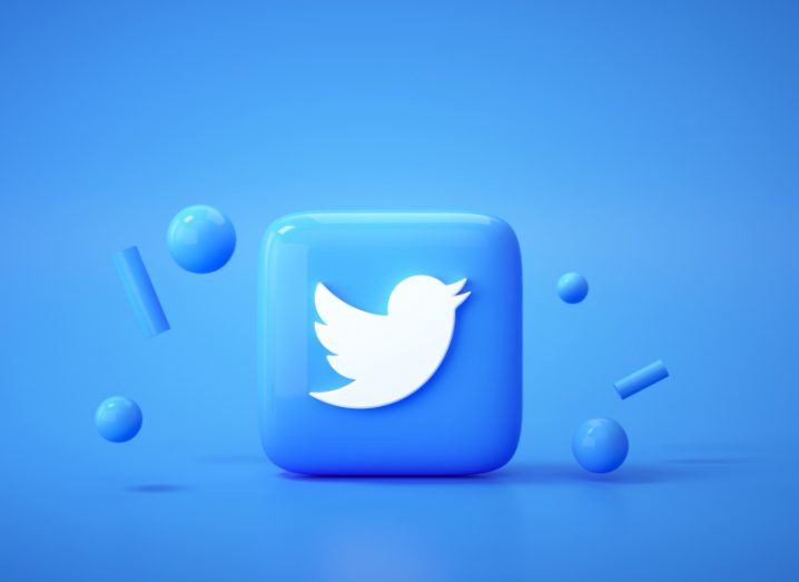 Illustration of the Twitter logo on a blue square, in a blue background with circle balls around it.