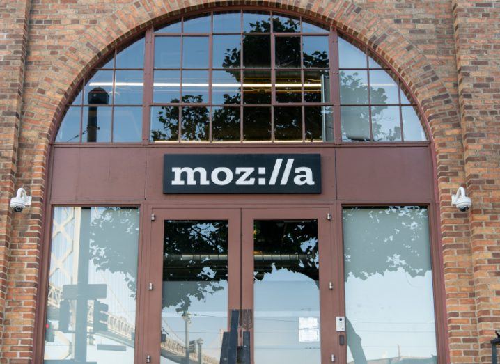 The Mozilla logo on the front of a brown building.