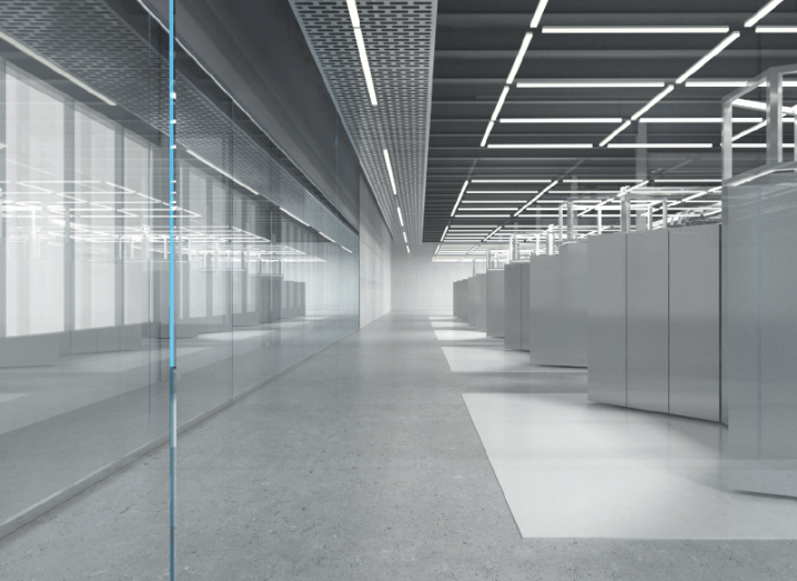 A grey hallway with square lights on the ceiling and a window reflecting these lights on the left of the image.