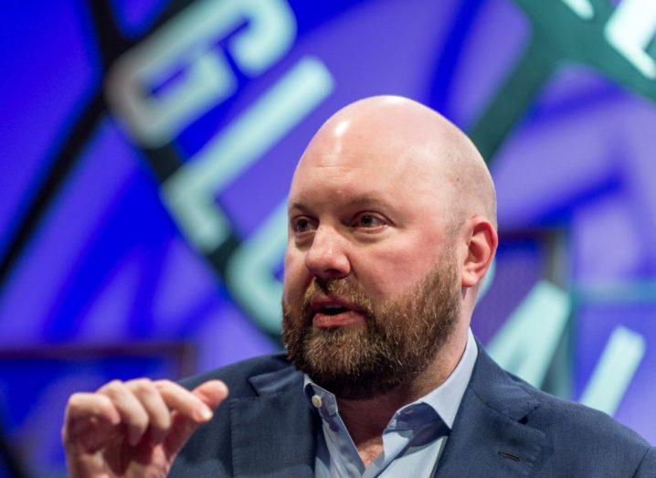 A man in a suit speaking with his hand near his head. He is Marc Andreessen, co-founder of VC firm Andreessen Horowitz.