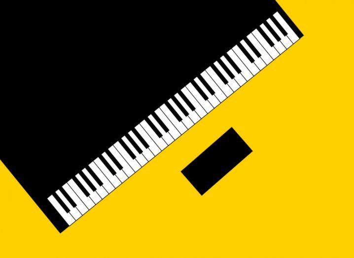 An overhead view of a stylised cartoon black piano with white keys on a bright yellow background.