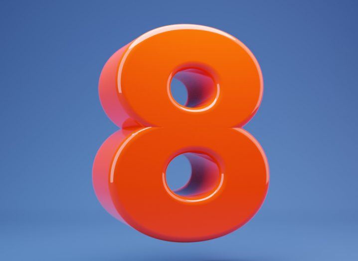 3D red number eight on a blue background.